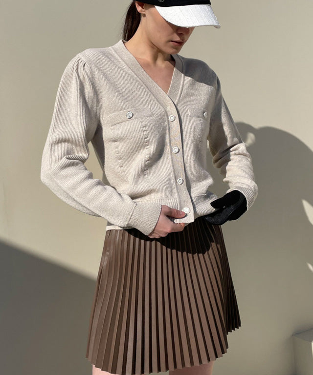 Anell Golf Bold Pleated Skirt in Brown, showcasing luxurious suede-combined leather with abundant pleats and a stylish design.