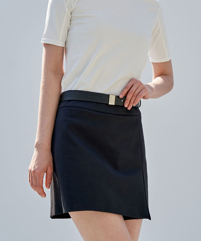 Anell Golf Classic H Skirt Pants in Black, showcasing a stylish skirt-pant hybrid design with front slit and belt loops.