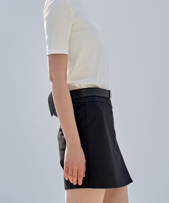 Anell Golf Classic H Skirt Pants in Black, showcasing a stylish skirt-pant hybrid design with front slit and belt loops.