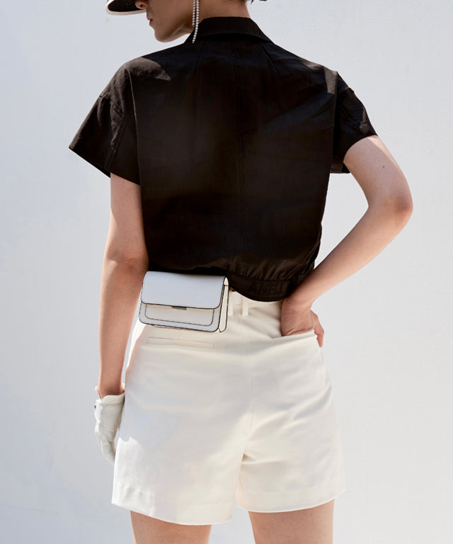 Anell Golf Cotton Wrap Skirt Pants in White, featuring a semi-A-line design with a comfortable fit and stylish diagonal slit.