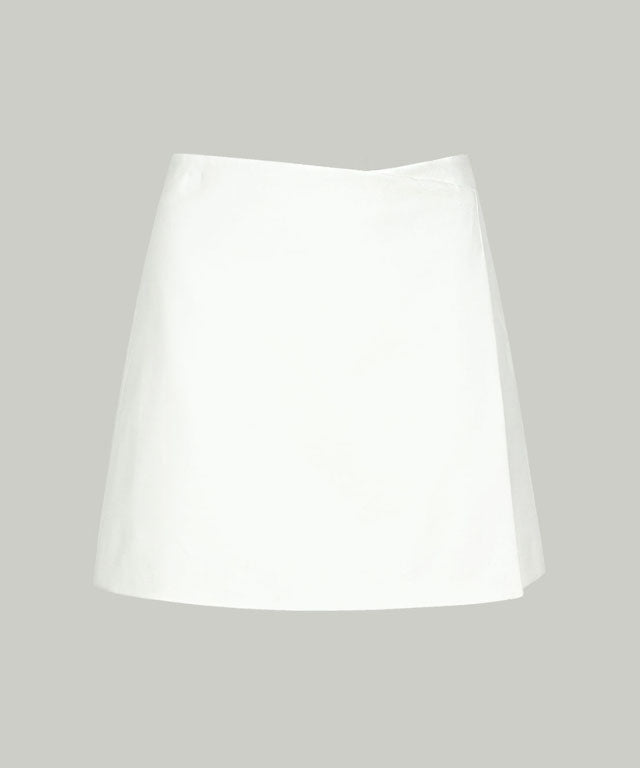 Anell Golf Cotton Wrap Skirt Pants in White, featuring a semi-A-line design with a comfortable fit and stylish diagonal slit.