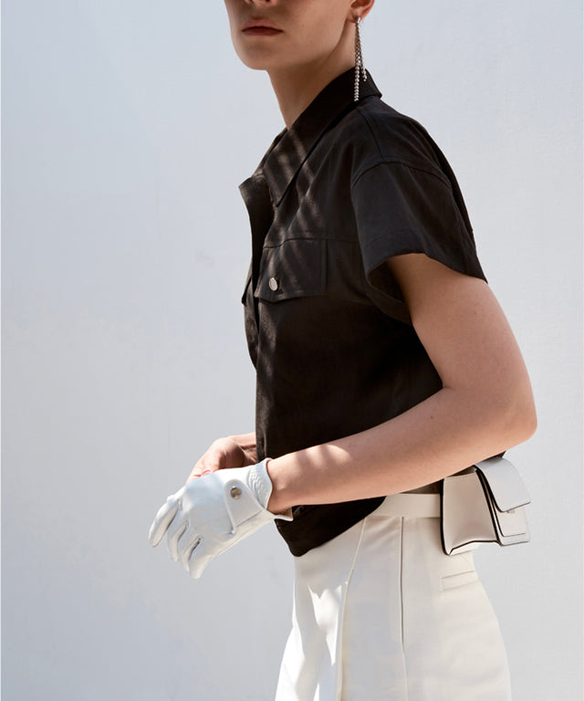 Anell Golf Cotton Wrap Skirt Pants in White, featuring a semi-A-line design with a comfortable fit and stylish diagonal slit.