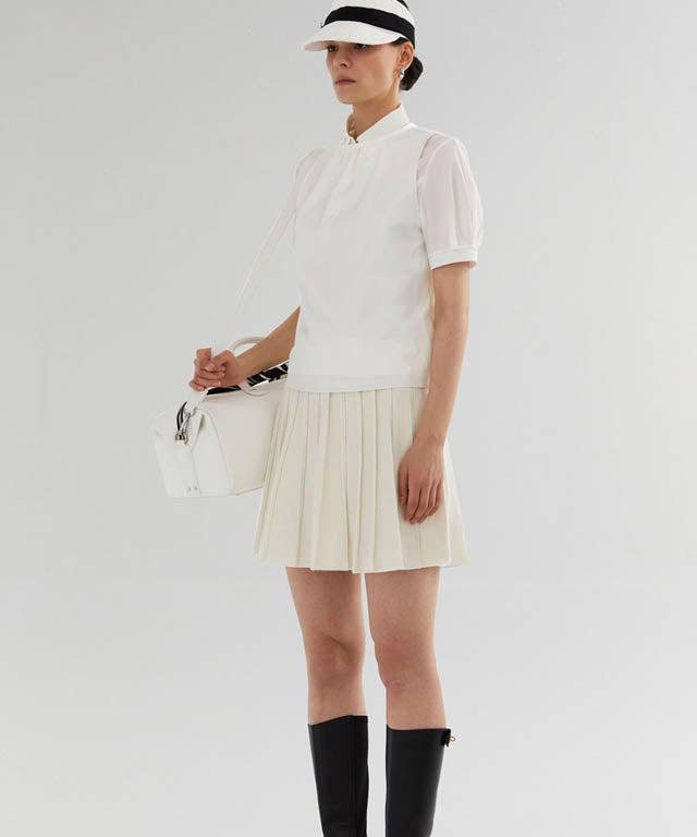 Anell Golf French Wool Skirt in Cream with pleated design and functional underpants, perfect for stylish golfing.