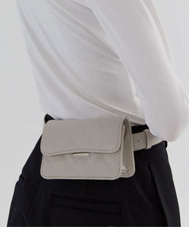 Anell Golf Quilted Belt Bag in black, white, and beige, showcasing stylish quilted design and adjustable belt.