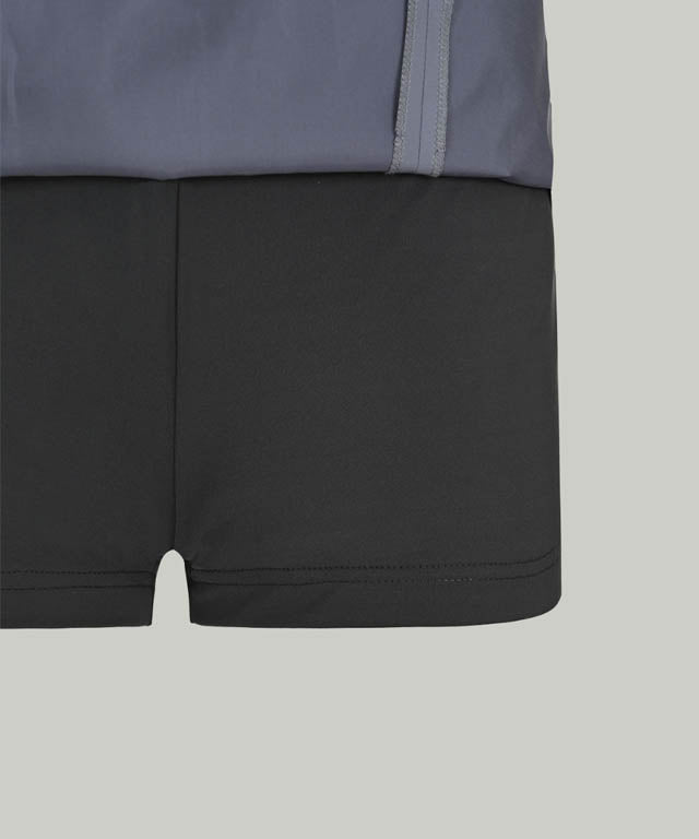 Anell Golf Slim Fit Full Skirt in Matte Blue, showcasing its voluminous flare and stylish design.