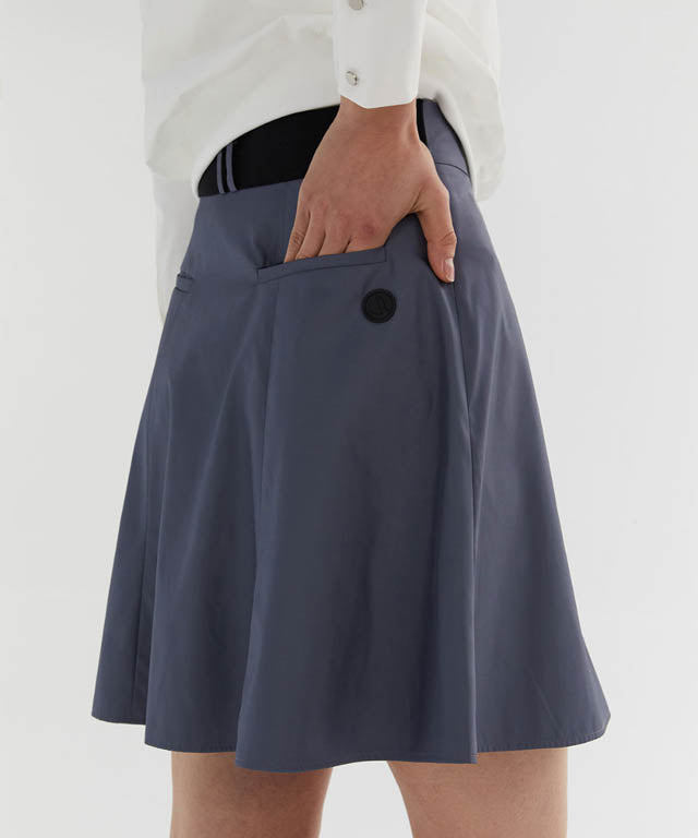 Anell Golf Slim Fit Full Skirt in Matte Blue, showcasing its voluminous flare and stylish design.