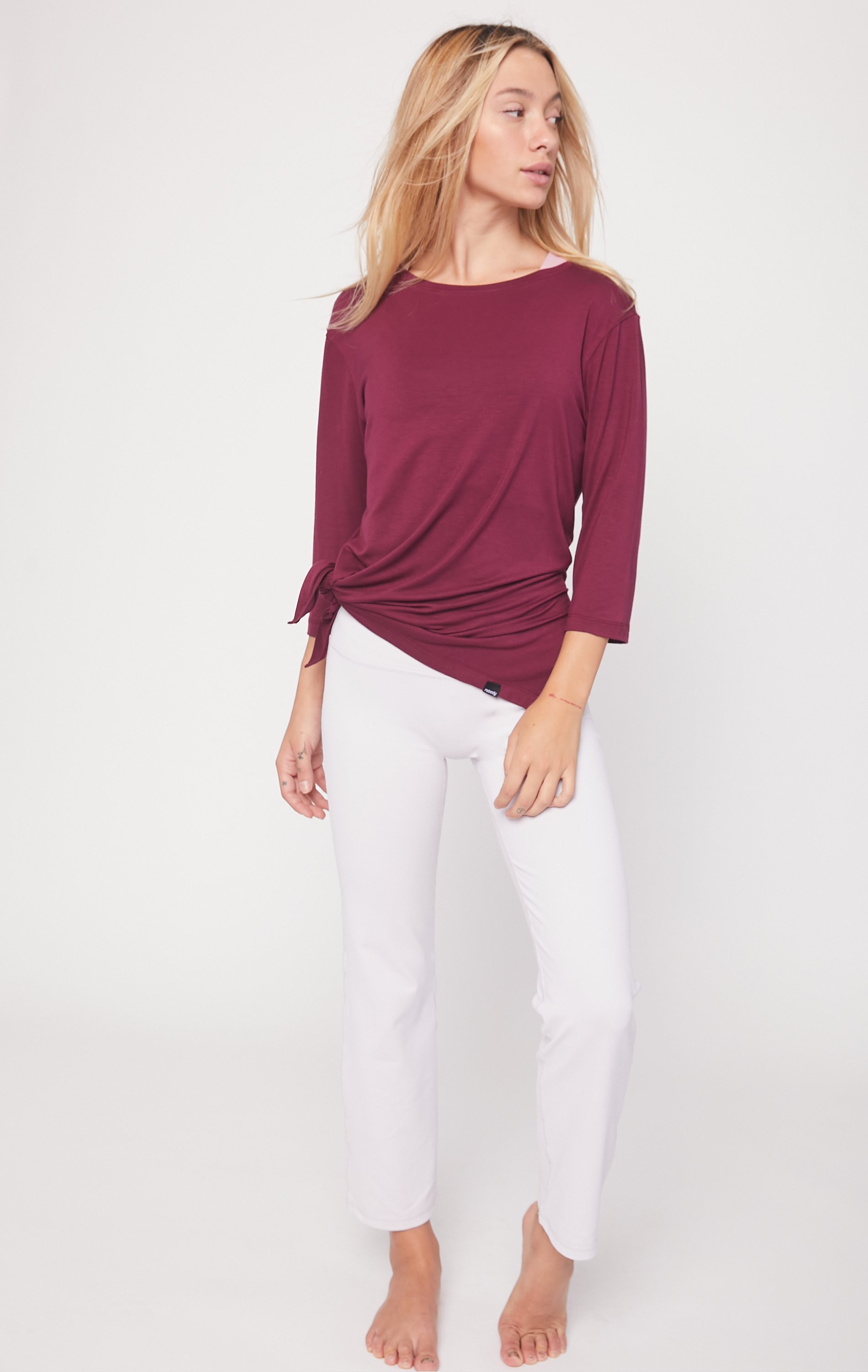 Anen Side Tie 3/4 Sleeve Top featuring a slightly elongated hem and customizable side tie design, made from cool rayon blend fabric.