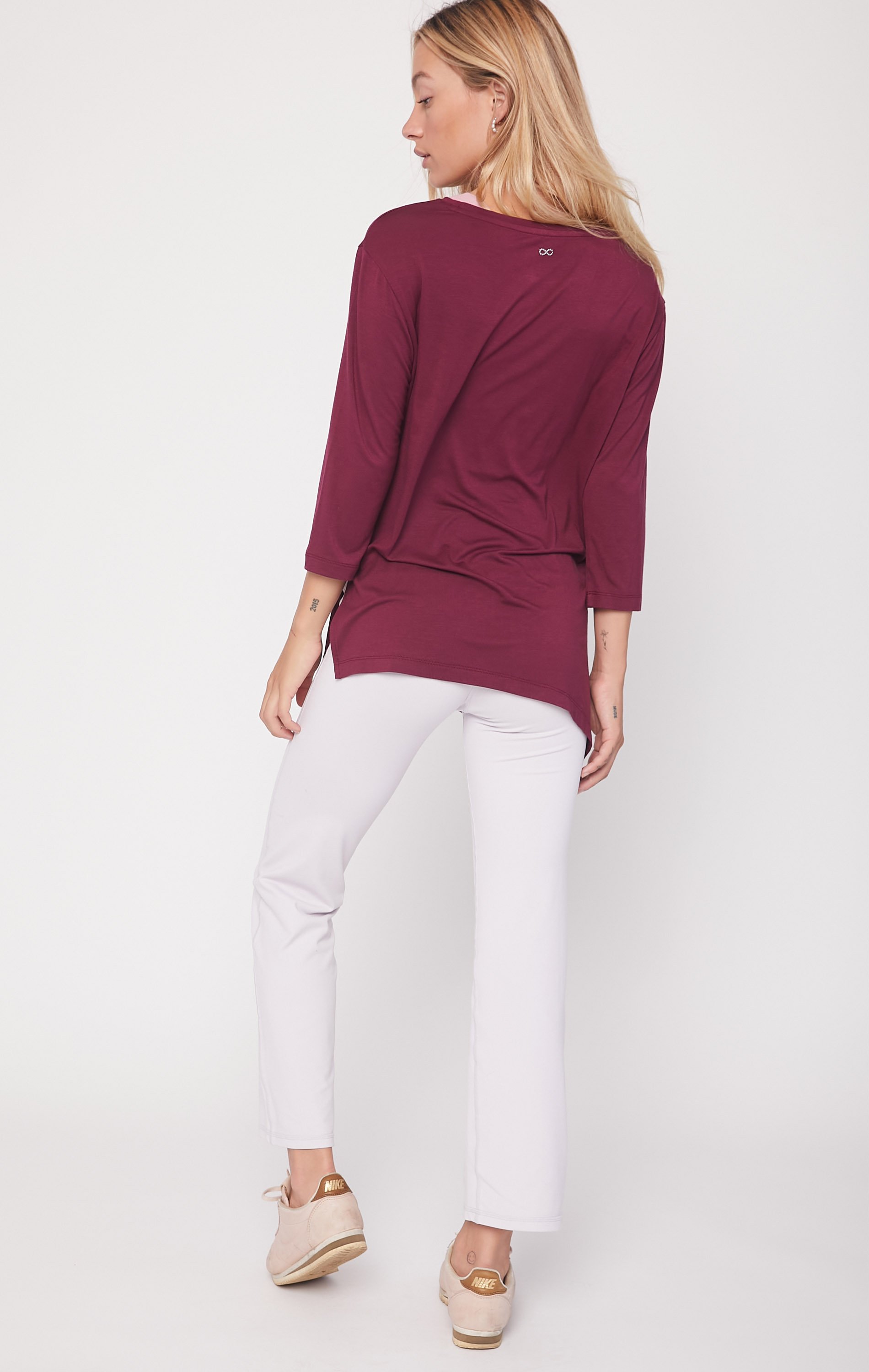 Anen Side Tie 3/4 Sleeve Top featuring a slightly elongated hem and customizable side tie design, made from cool rayon blend fabric.