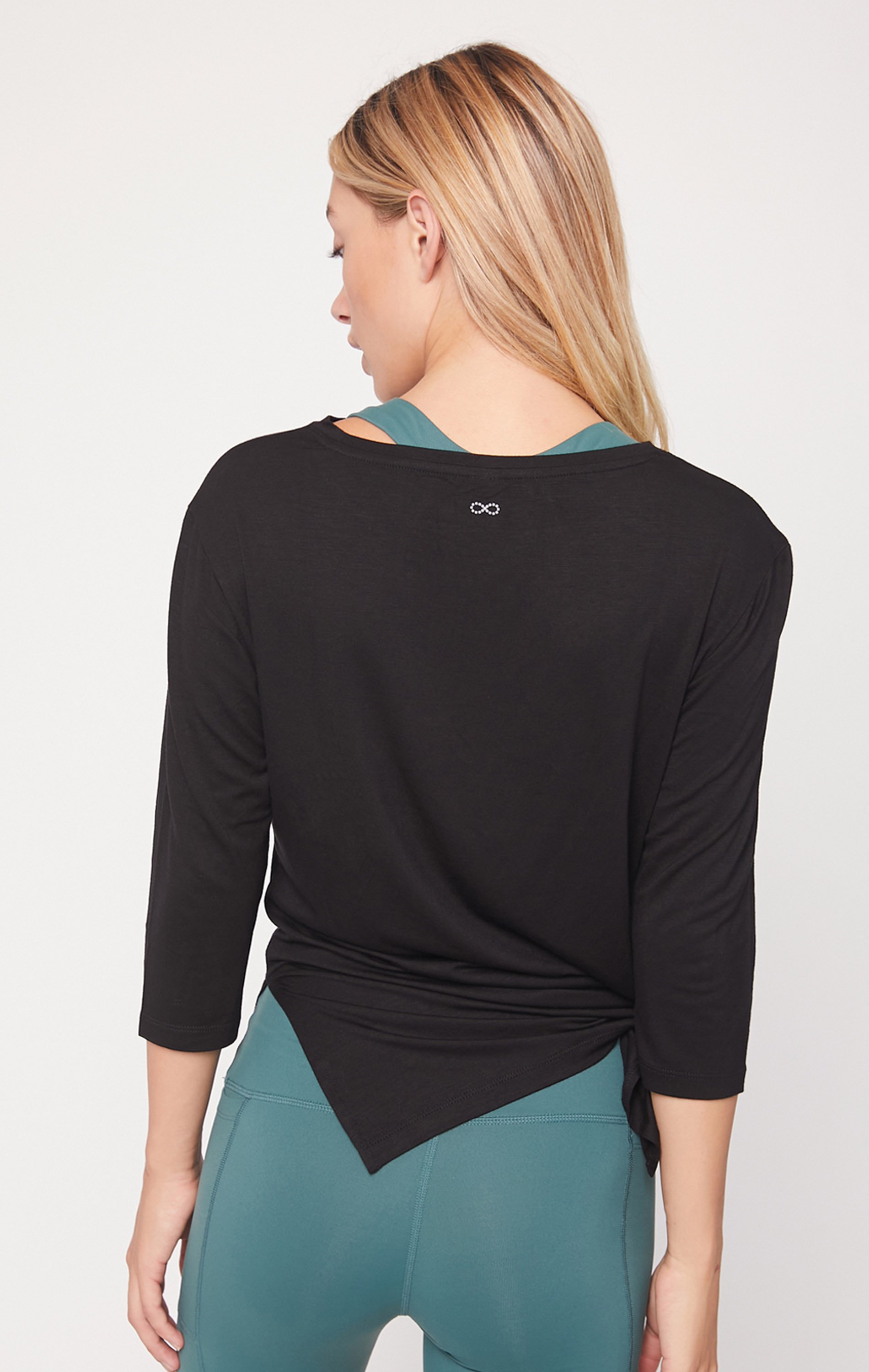 Anen Side Tie 3/4 Sleeve Top featuring a slightly elongated hem and customizable side tie design, made from cool rayon blend fabric.