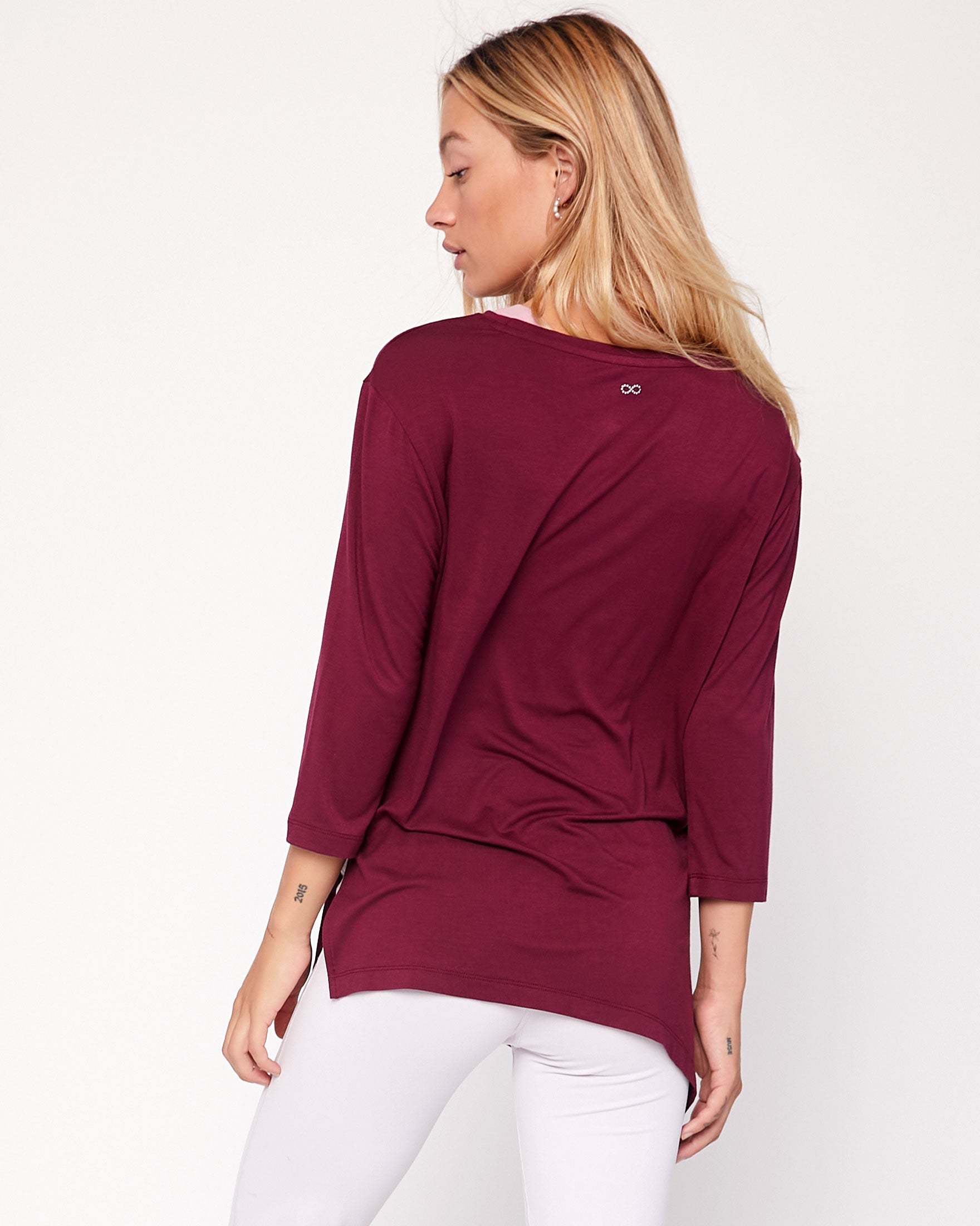 Anen Side Tie 3/4 Sleeve Top featuring a stylish side tie and elongated hem, perfect for layering and comfort.