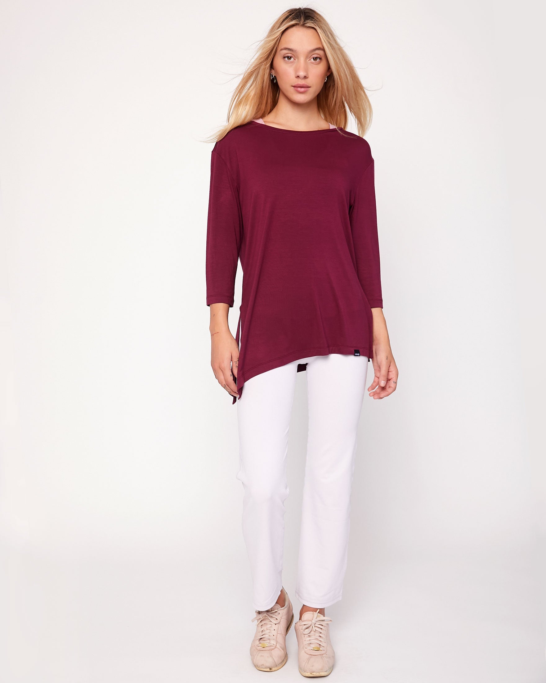 Anen Side Tie 3/4 Sleeve Top featuring a stylish side tie and elongated hem, perfect for layering and comfort.