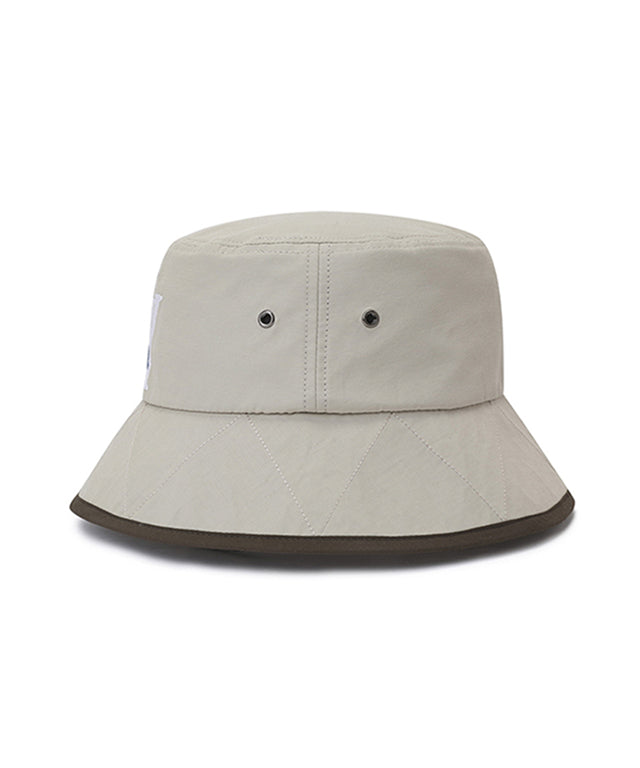 ANEW Golf Double Logo Bucket Hat featuring double logos and zigzag embroidery, with a detachable chin strap for secure fit.