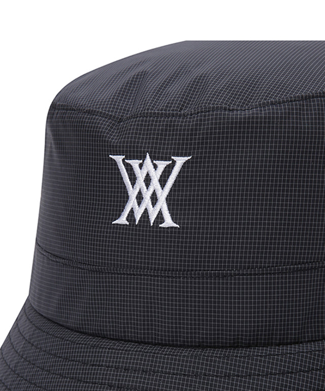 ANEW Golf Nylon Ripstop Bucket Hat featuring a stylish graphic logo, lightweight design, and detachable strap for windy conditions.