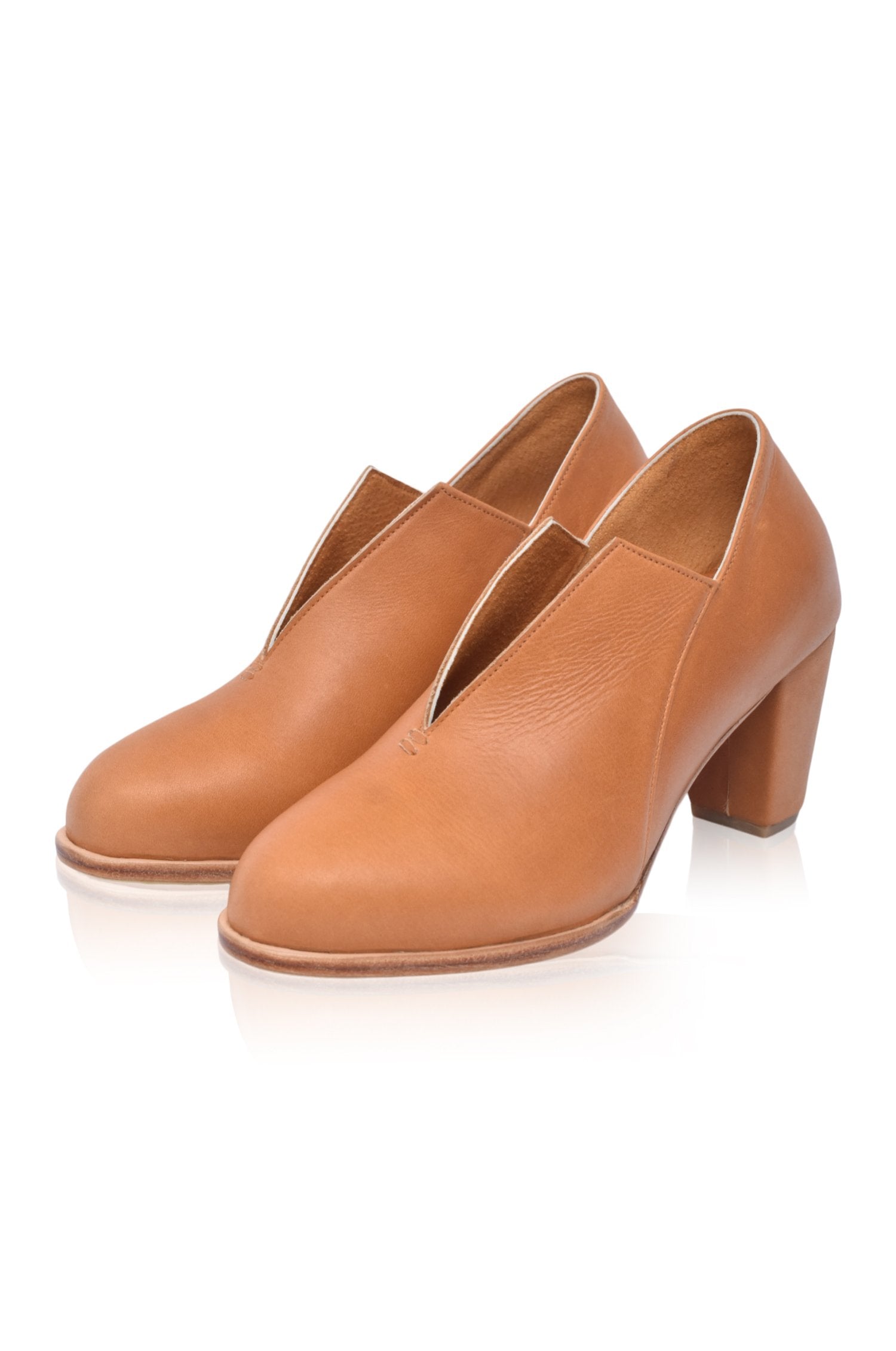 Ange Leather Heel Booties featuring a chic below-ankle design with a leather-wrapped heel and almond-shaped toe, perfect for stylish outfits.