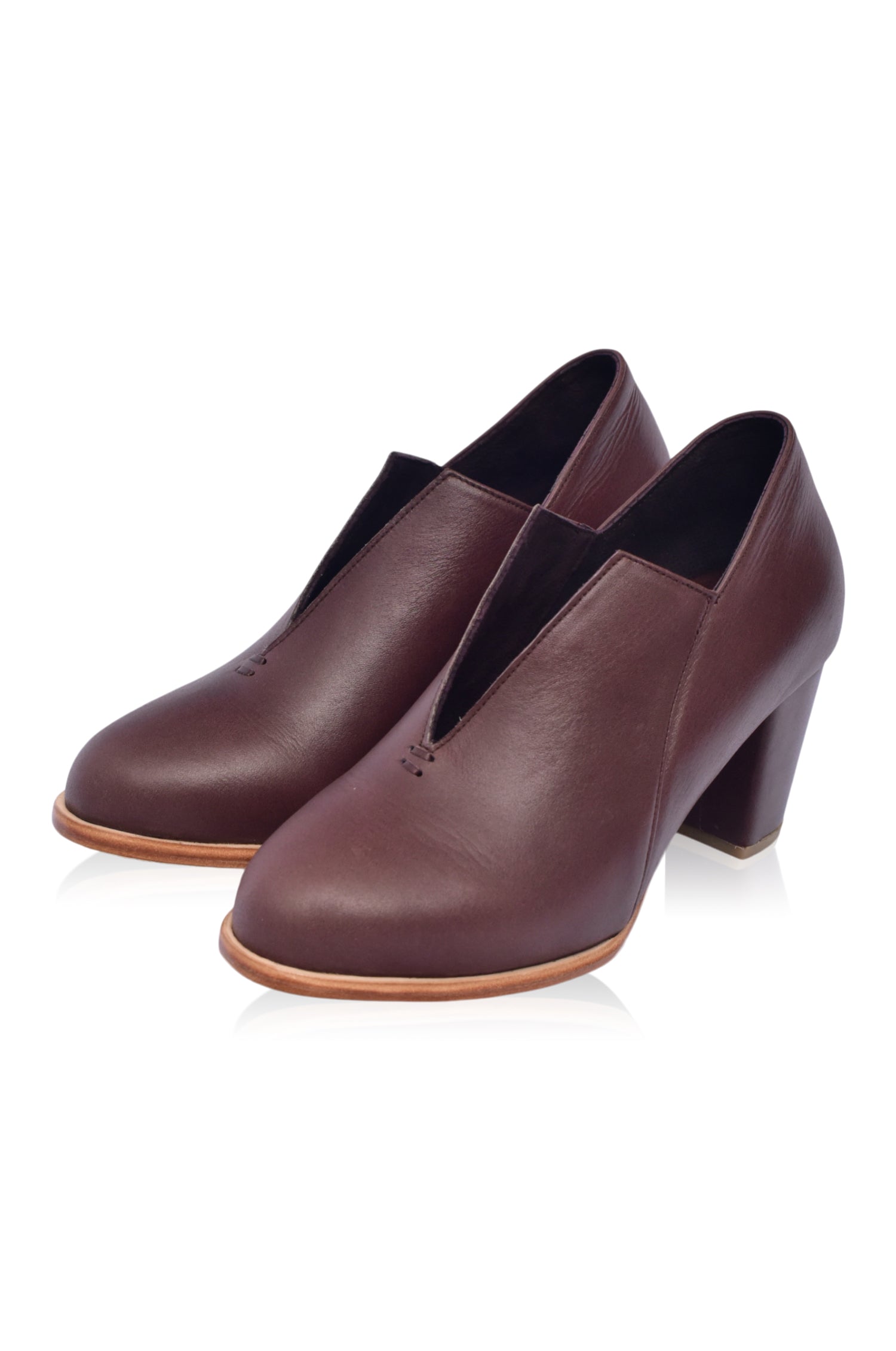 Ange Leather Heel Booties featuring a chic below-ankle design with a leather-wrapped heel and almond-shaped toe, perfect for stylish outfits.