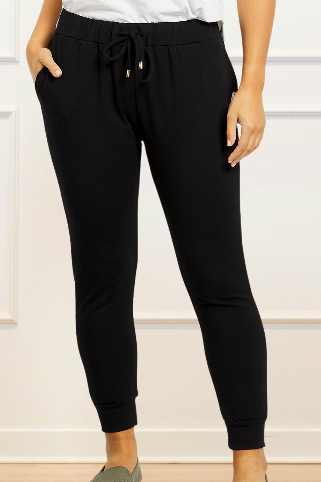 Angie Chic Quality Sweatpants in black with drawstring waist and side pockets, showcasing a relaxed fit and ribbed cuffs.