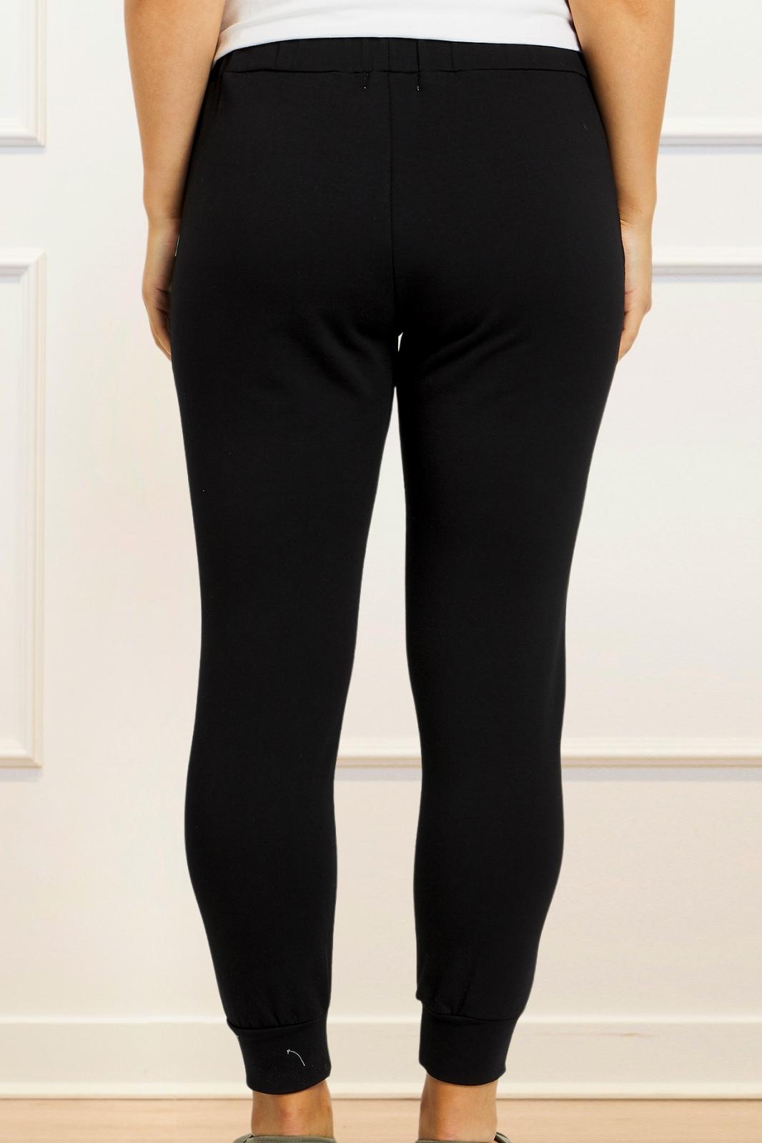 Angie Chic Quality Sweatpants in black with drawstring waist and side pockets, showcasing a relaxed fit and ribbed cuffs.