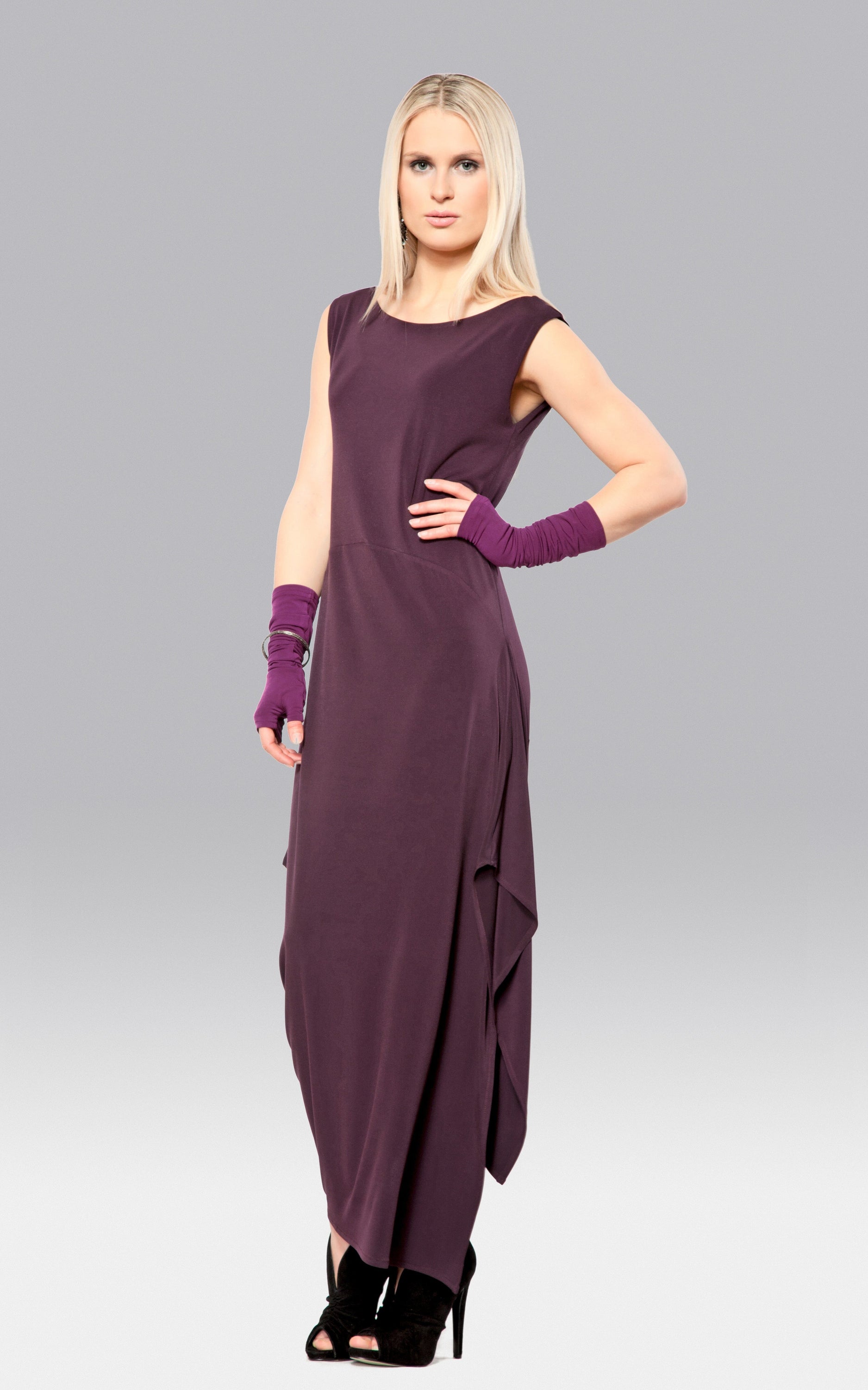 A stylish Angled Dress featuring a double layer bodice and asymmetric hem, perfect for modern fashion enthusiasts.