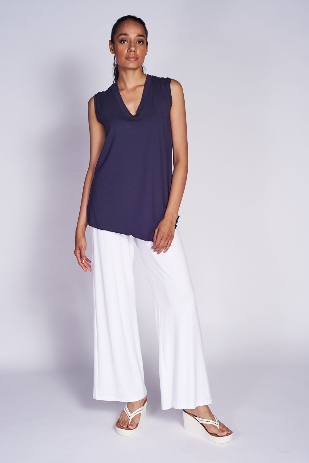 Angled Tank Top made from soft bamboo fabric, featuring wider shoulder straps and a stylish side slit for a flattering fit.