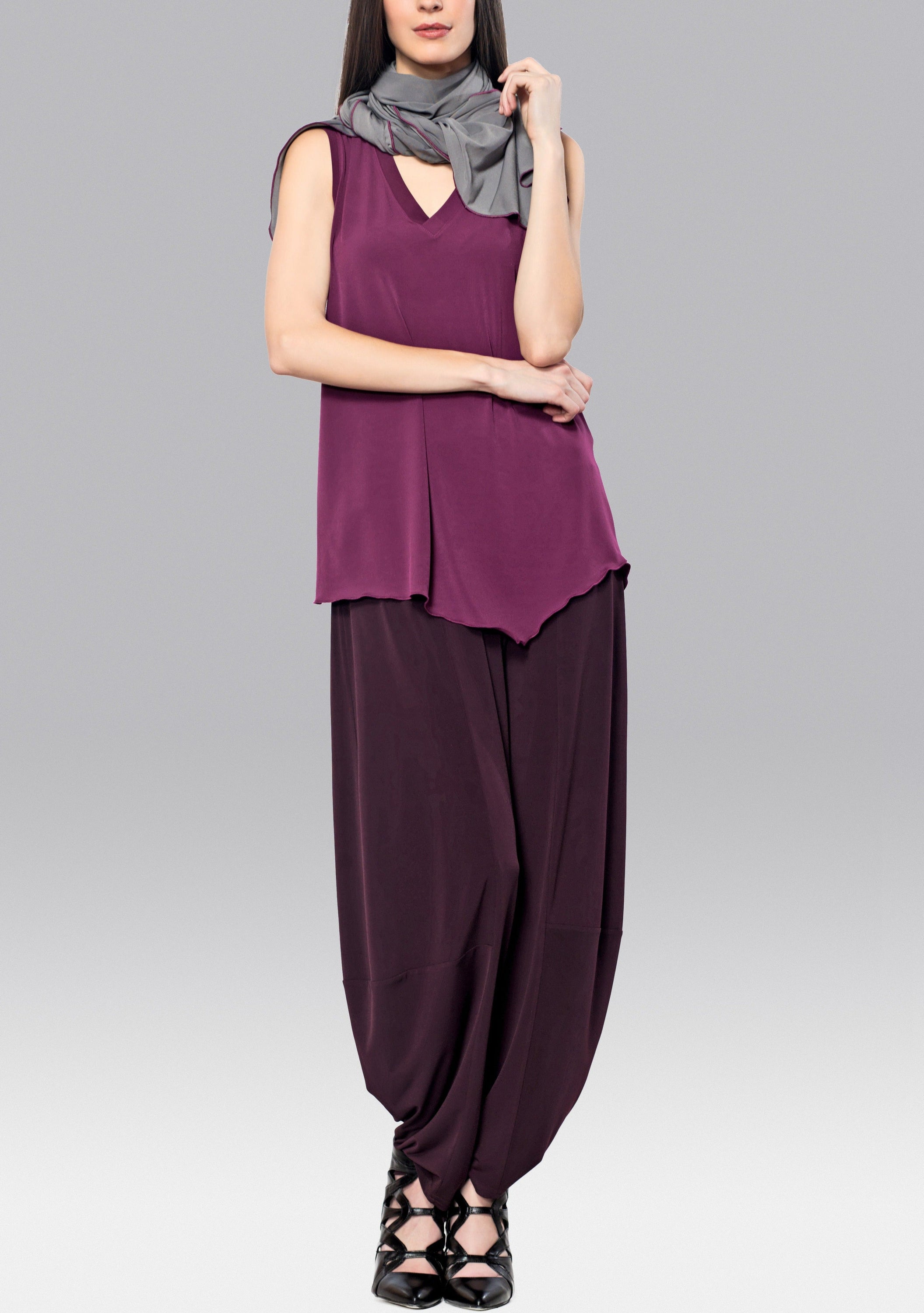 Berry colored Angled Tank Top with wider shoulder straps and side slit, showcasing a modern and flattering design.