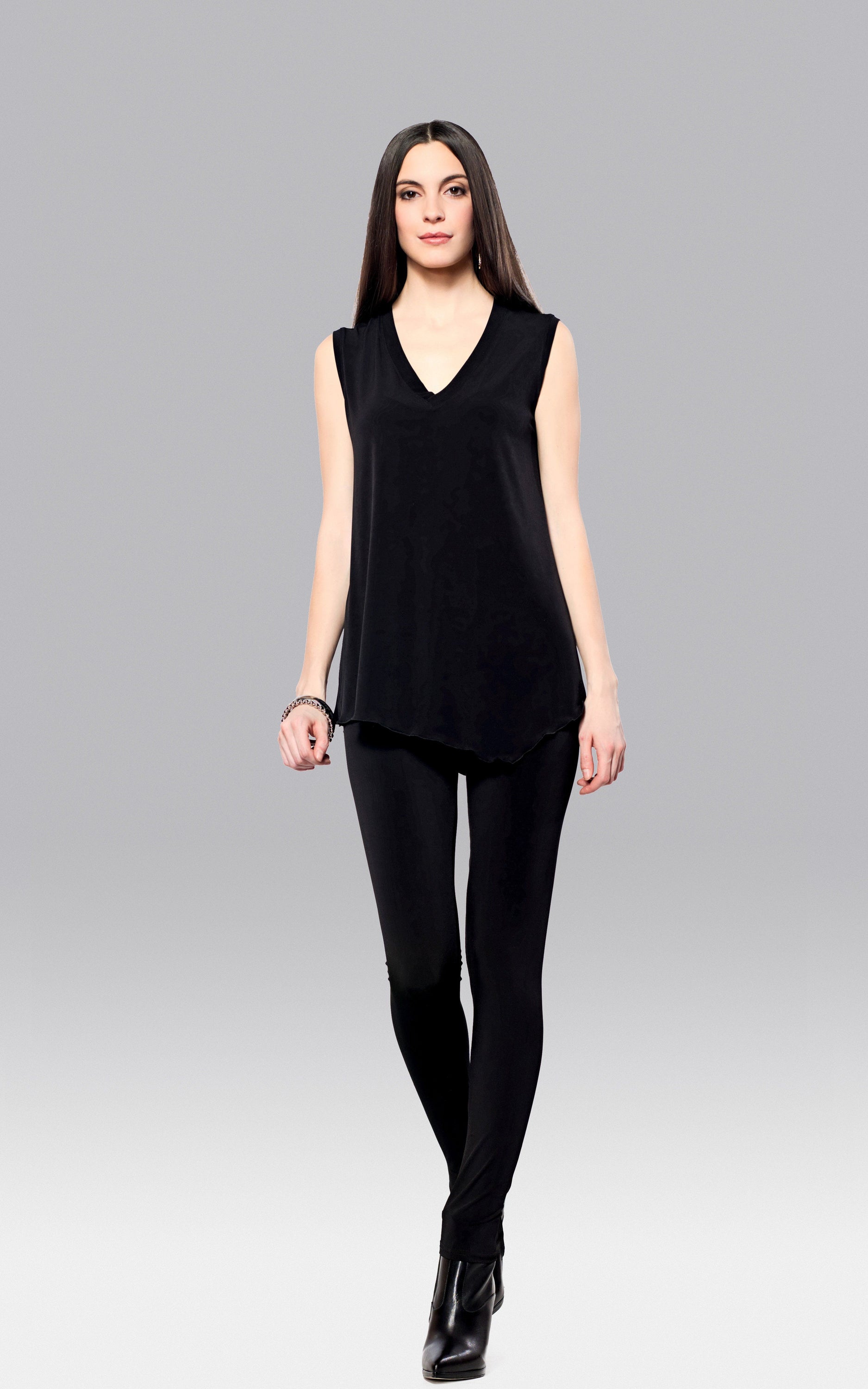 A stylish Angled Tank Top featuring wider shoulder straps and a side slit, made from soft lightweight fabric.