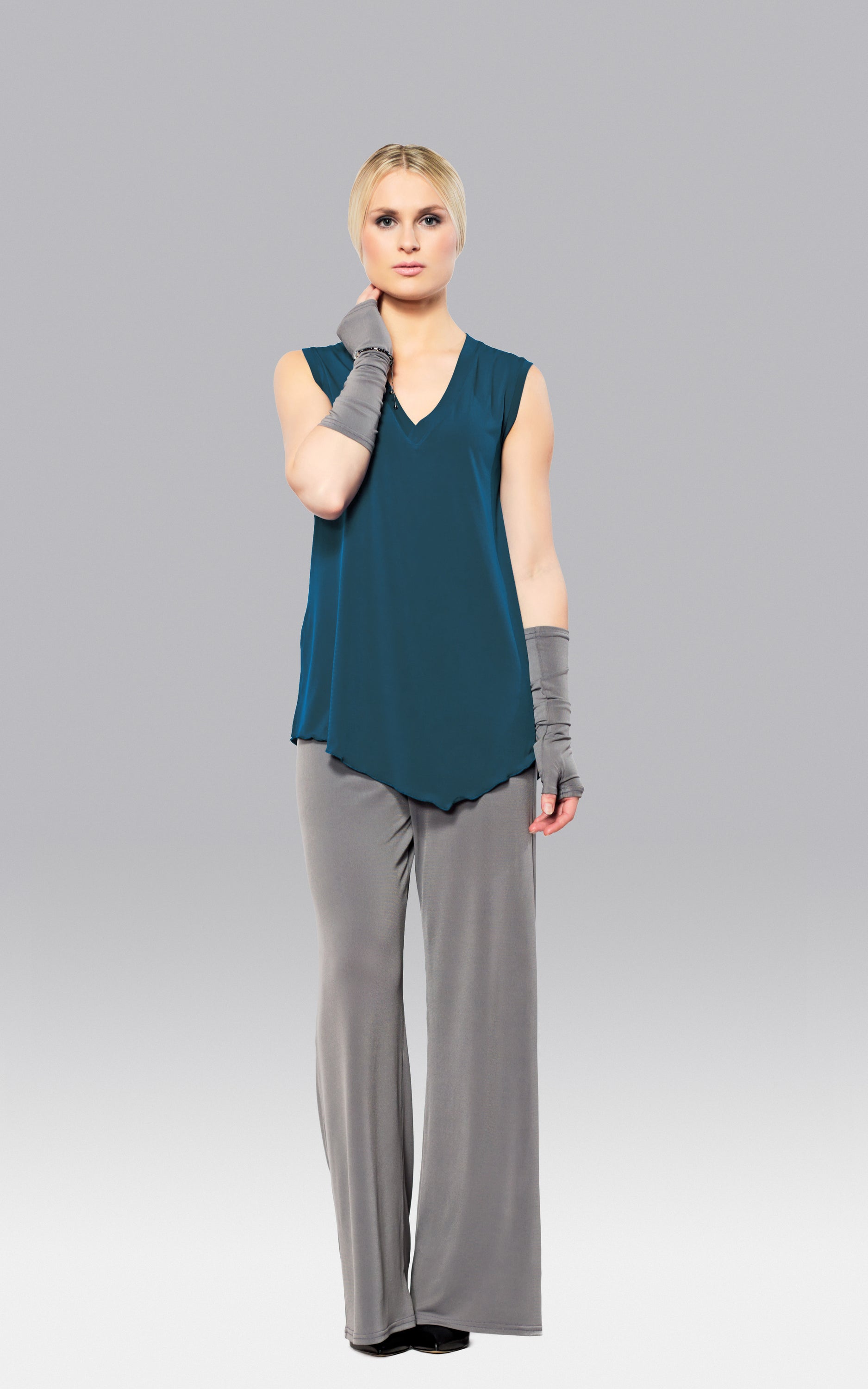 A stylish Angled Tank Top featuring wider shoulder straps and a side slit, made from soft lightweight fabric.