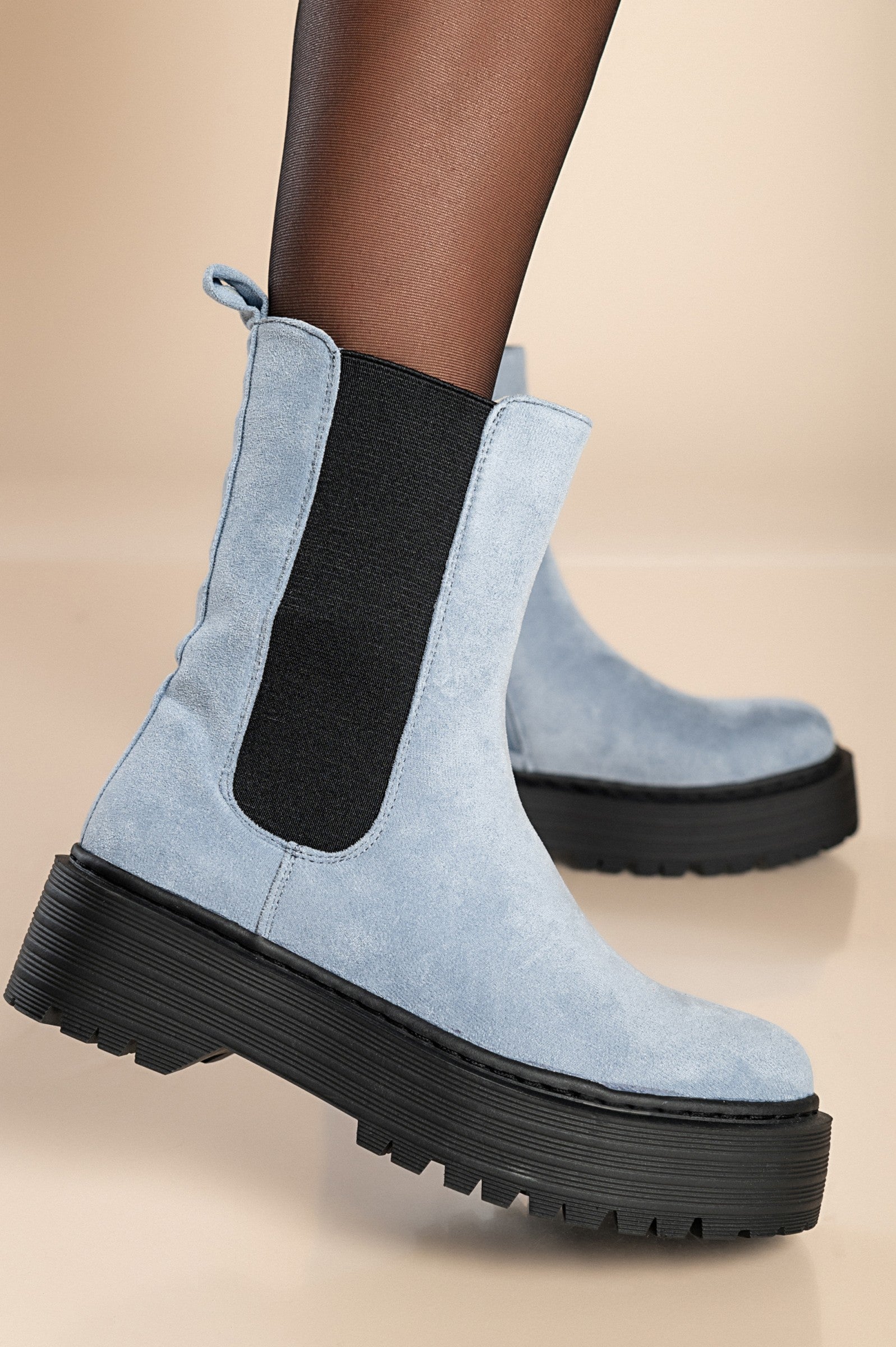 Elegant blue ankle boots with elastic sides and round toe design, perfect for stylish comfort.