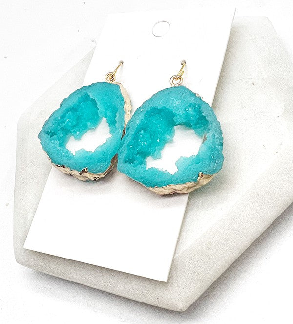 Aqua agate slice resin statement earrings with gold accents, showcasing a unique design and lightweight construction.