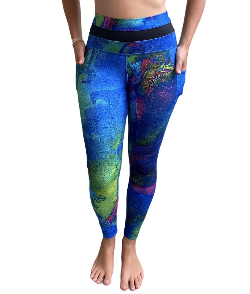 Aqua Yoga Leggings with Pockets featuring a high-rise design and vibrant hand-painted patterns, perfect for yoga and casual wear.