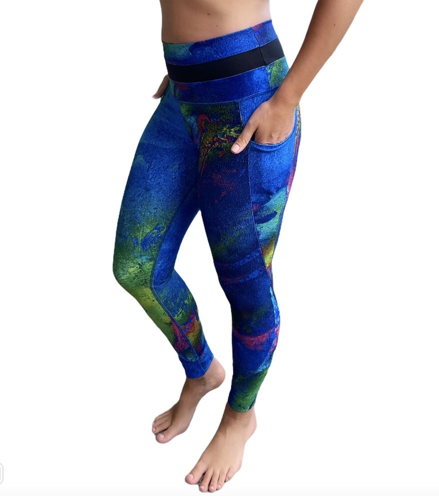 Aqua Yoga Leggings with Pockets featuring a high-rise design and vibrant hand-painted patterns, perfect for yoga and casual wear.