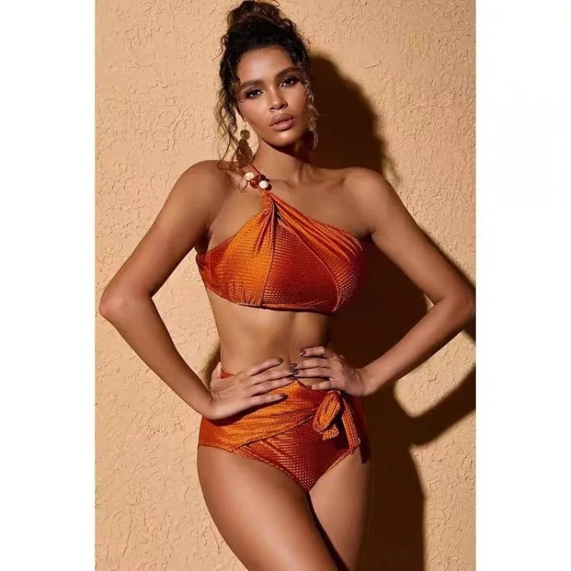 Aquata Two-Piece Swimsuit featuring a high-waisted bottom and wire-free top, available in solid and print patterns.