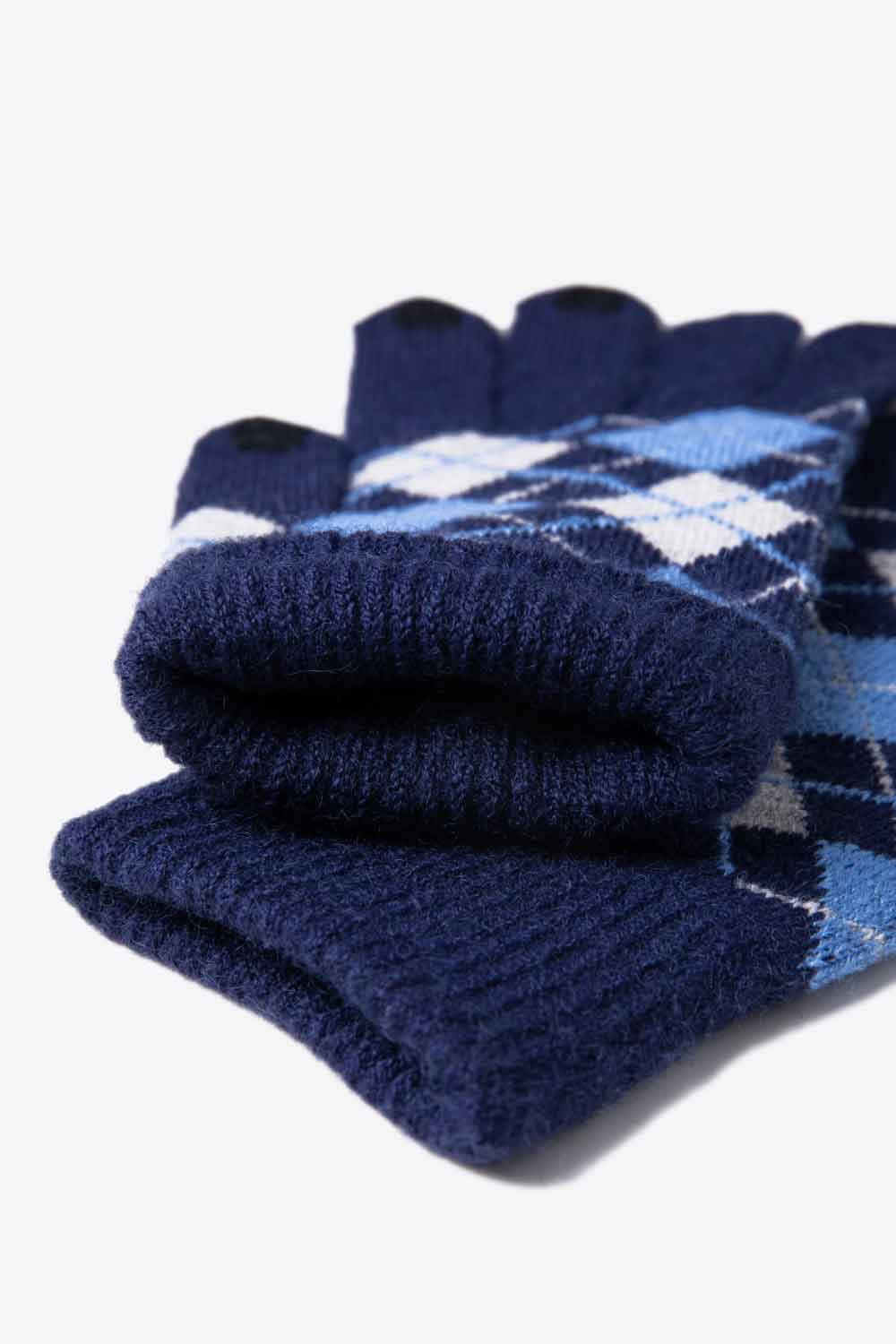 A flat lay image of Argyle Knit Gloves showcasing their stylish pattern and soft acrylic material.