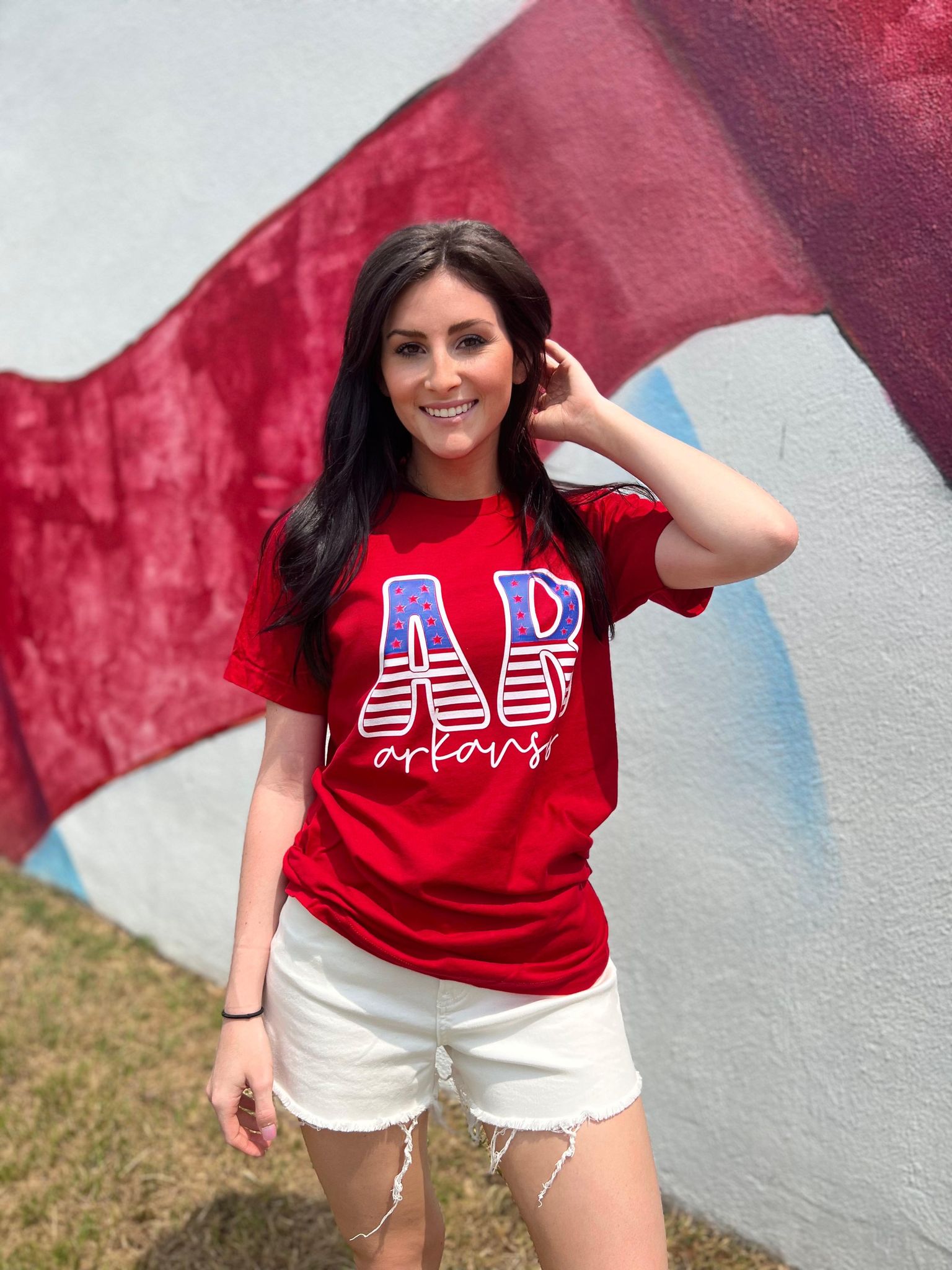 A stylish Arkansas Stars and Stripes Tee featuring vibrant colors and a comfortable fit, perfect for celebrating the 4th of July.