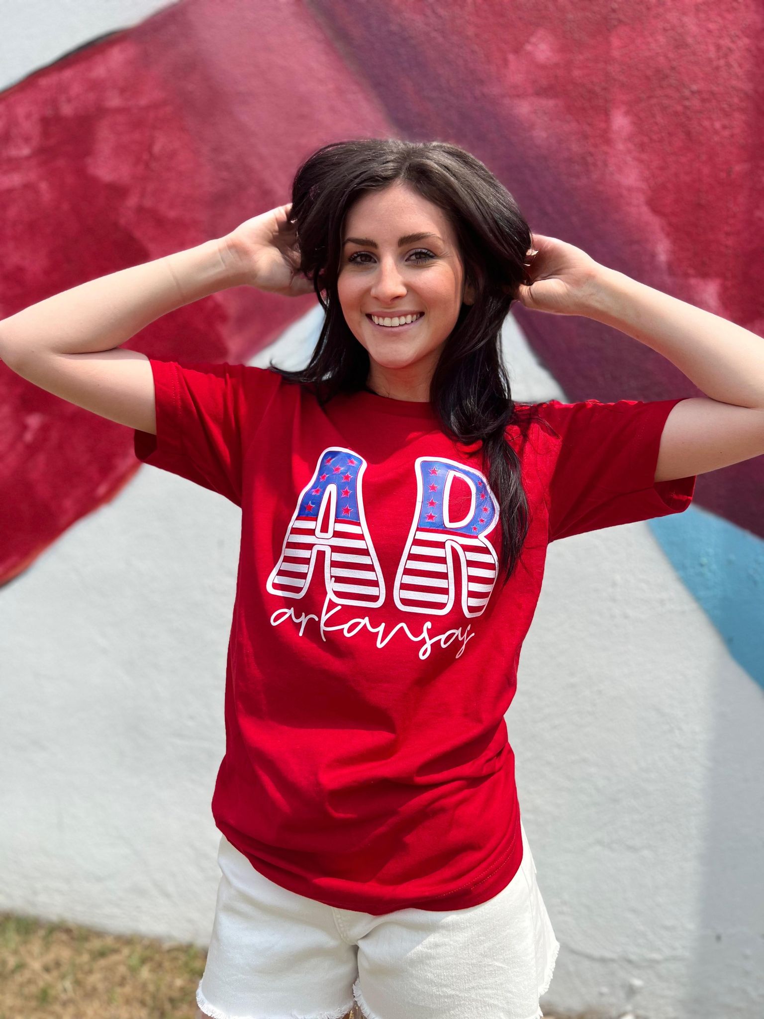 A stylish Arkansas Stars and Stripes Tee featuring vibrant colors and a comfortable fit, perfect for celebrating the 4th of July.