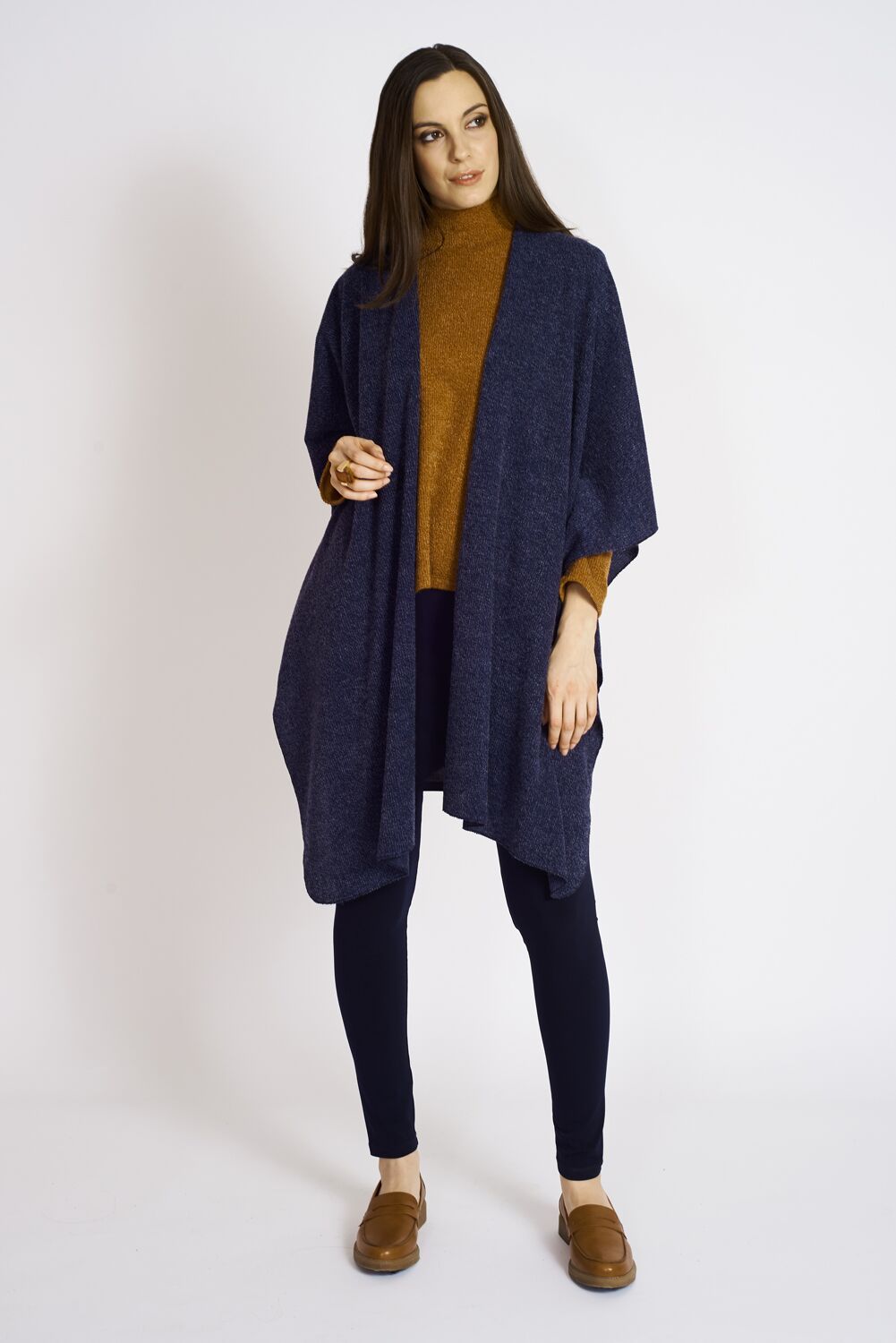 A cozy Ashmore Sweater Knit Shawl in versatile colors, perfect for winter layering.