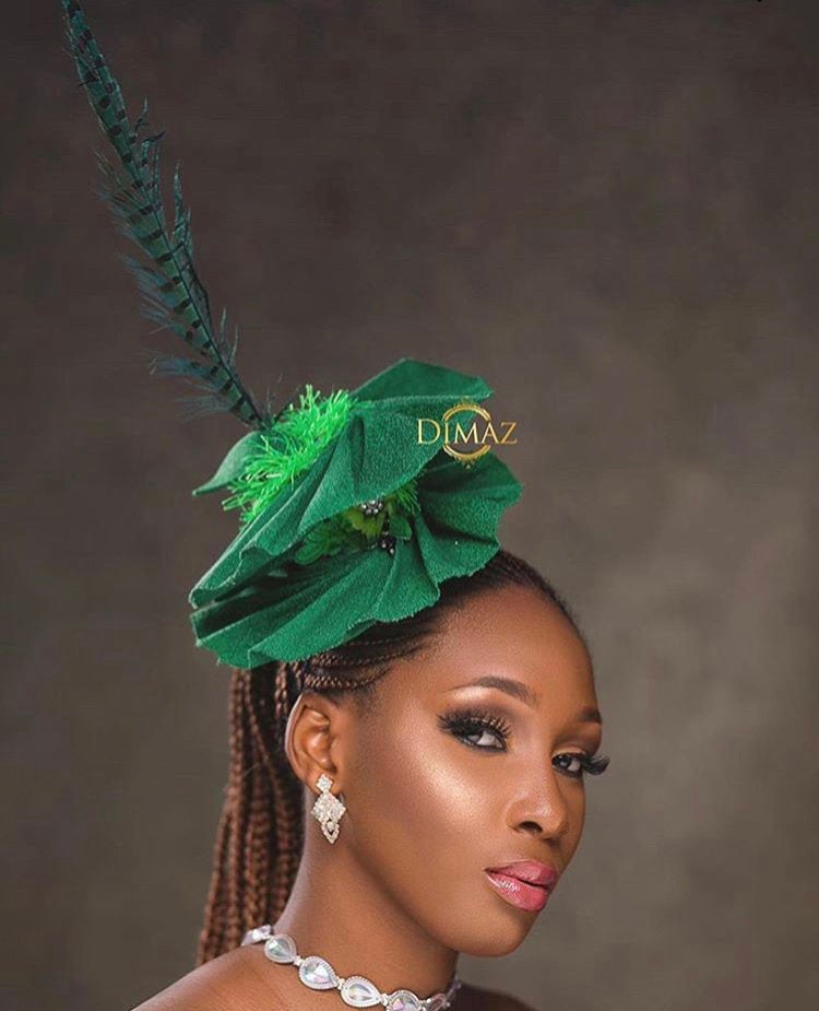 Elegant Asooke Fascinator with embellishments and feathers, perfect for Nigerian events.