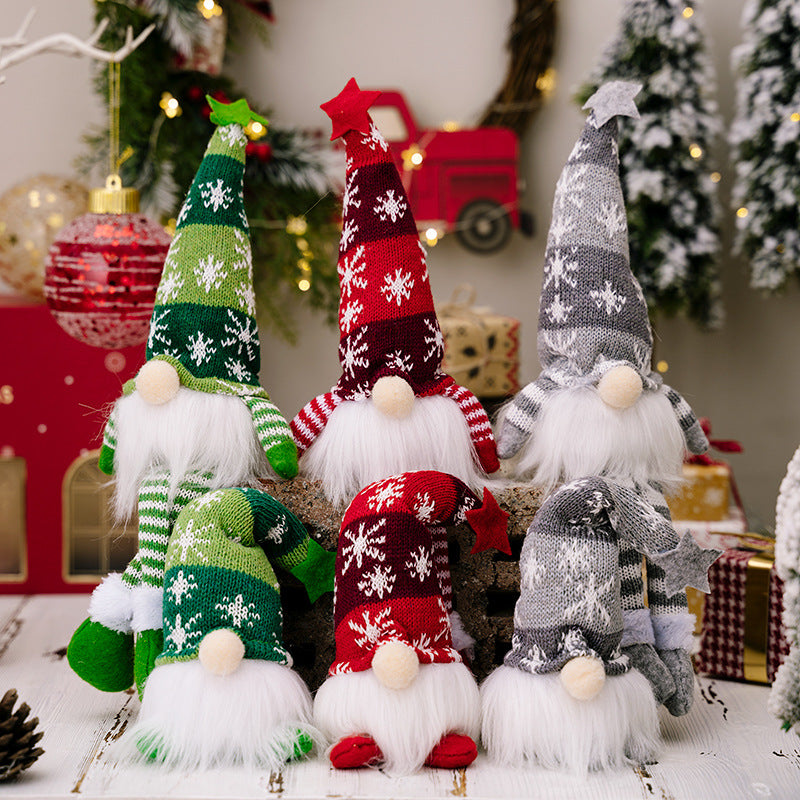 Two assorted light-up faceless gnomes in vibrant colors, showcasing their whimsical design and glowing features.