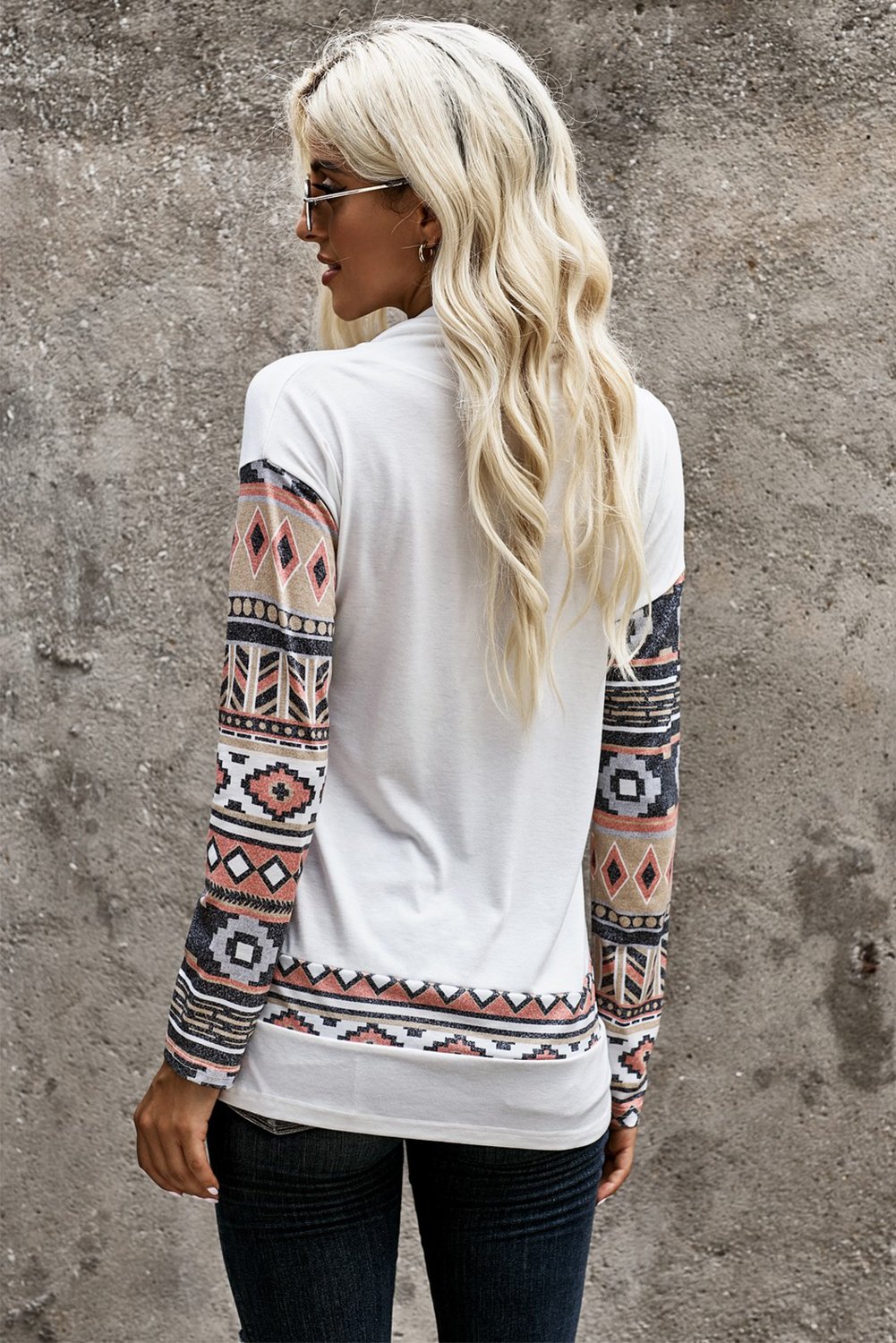 Asymmetric Buttoned Nomadic Sleeve Sweatshirt featuring unique print and stylish cowl neck design.