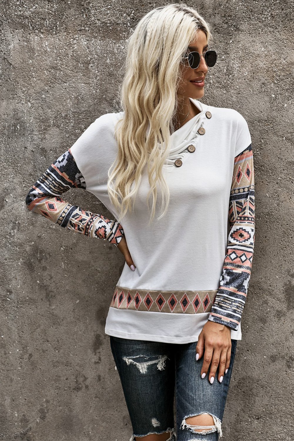 Asymmetric Buttoned Nomadic Sleeve Sweatshirt featuring unique print and stylish cowl neck design.