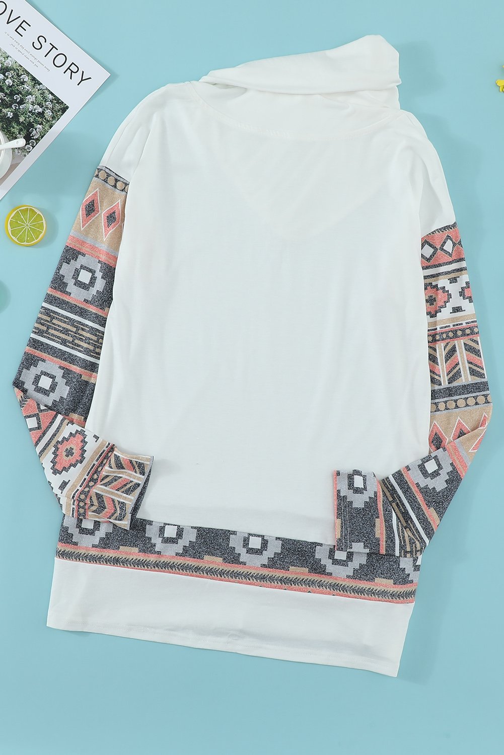 Asymmetric Buttoned Nomadic Sleeve Sweatshirt featuring unique print and stylish cowl neck design.