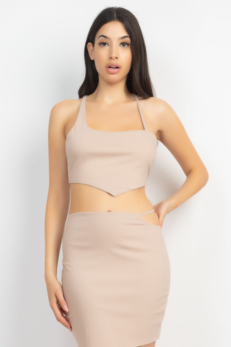 Asymmetrical Cross Back Top & Skirts Set in Light Taupe, featuring a cropped tank top and high-waisted mini skirt with unique design elements.