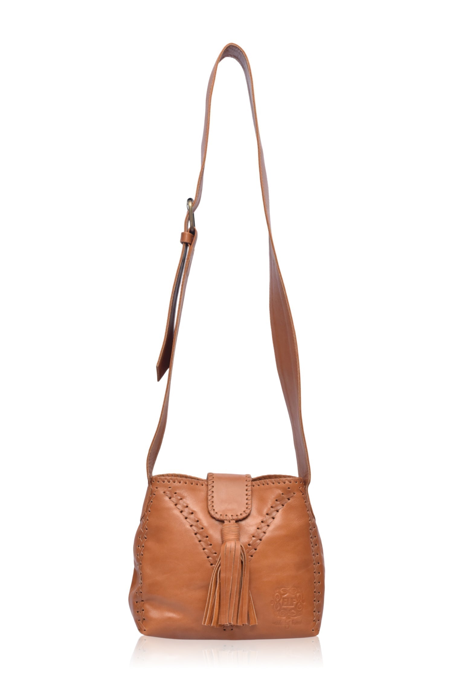 Atacama Small Crossbody Bag made of high-quality leather with intricate stitching, featuring an adjustable strap and multiple pockets.