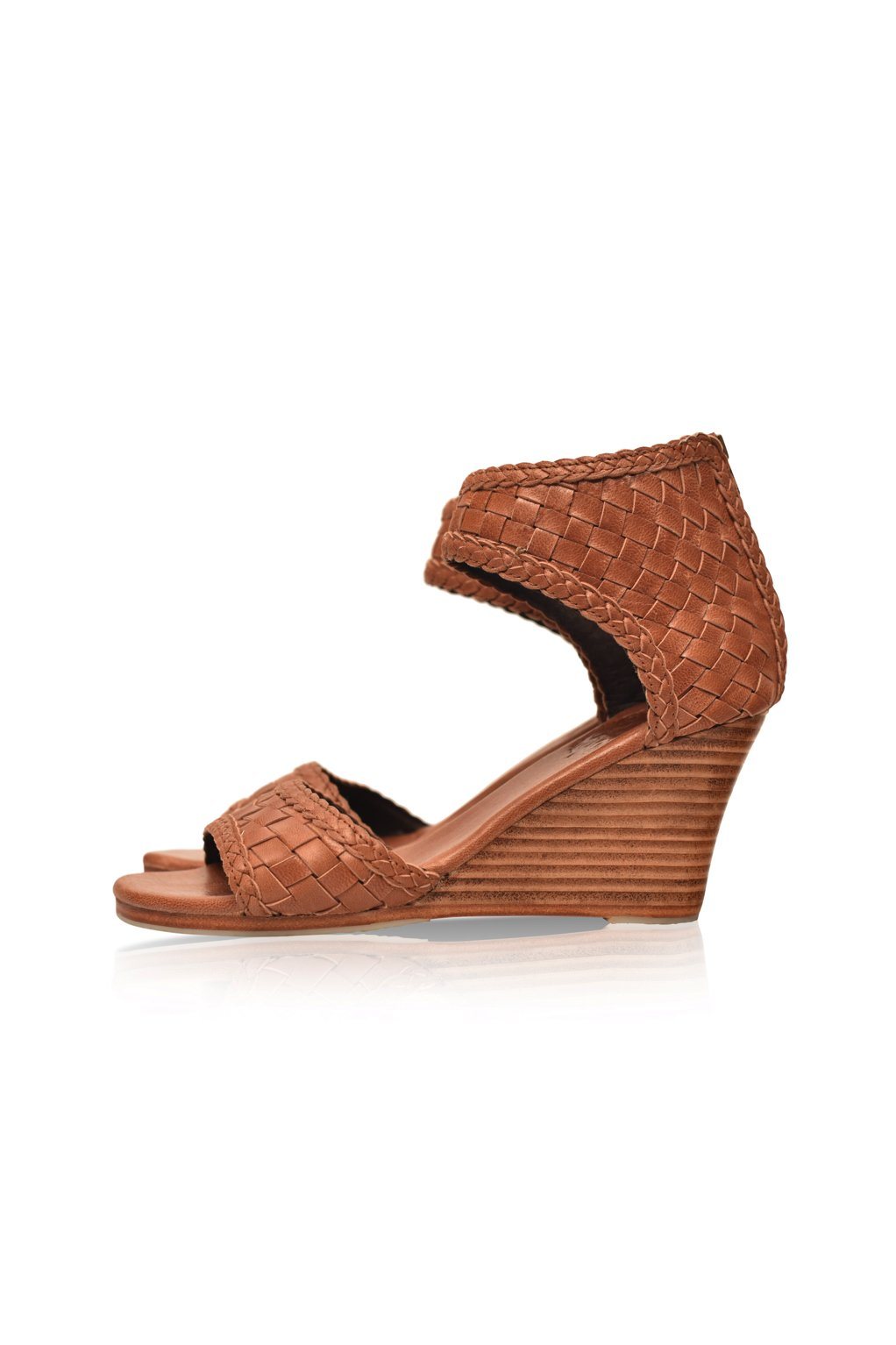 Athena Leather Wedges showcasing woven leather design with braided detailing and a wooden wedge heel.