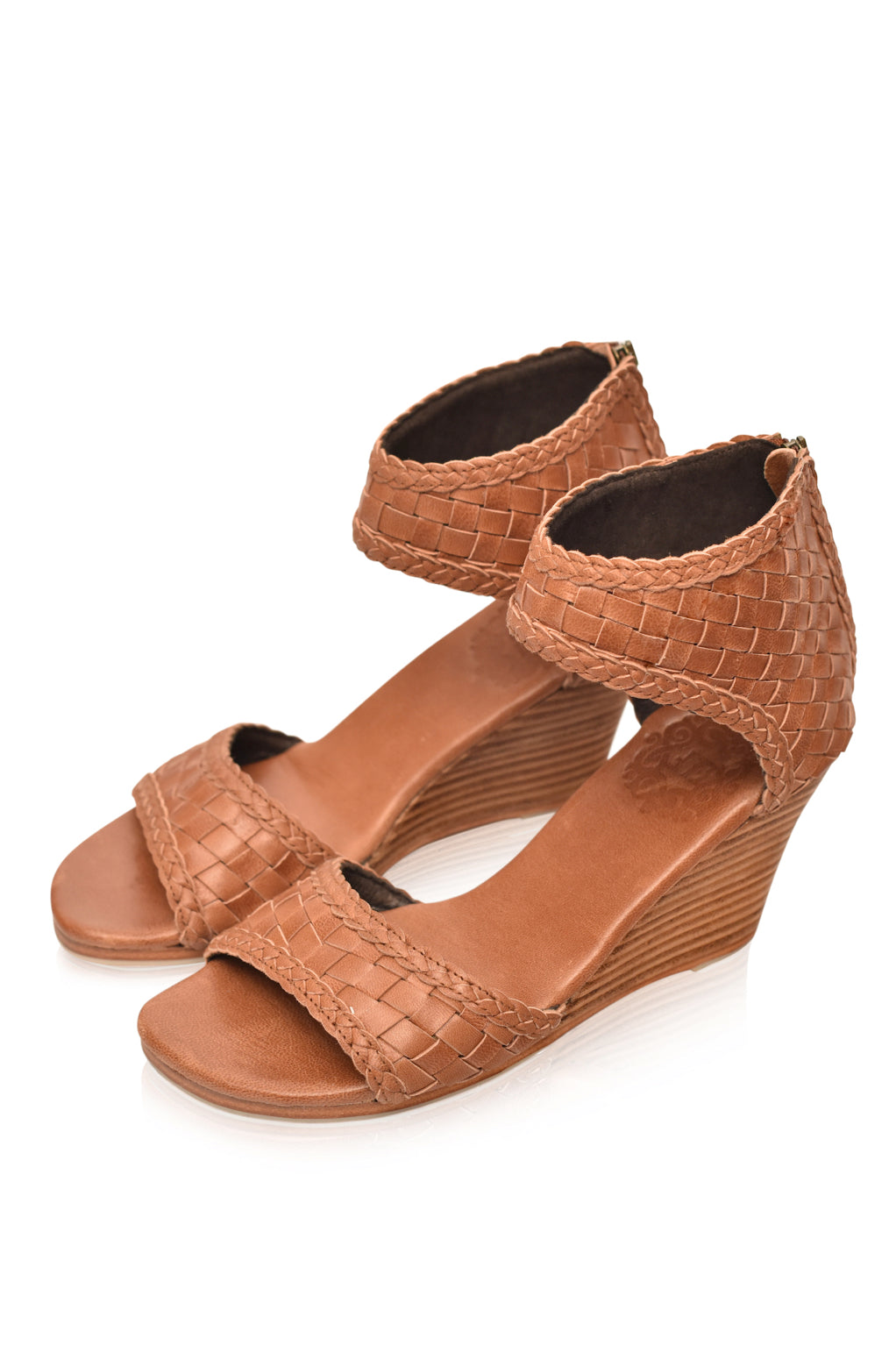 Athena Leather Wedges showcasing woven leather design with braided detailing and a wooden wedge heel.