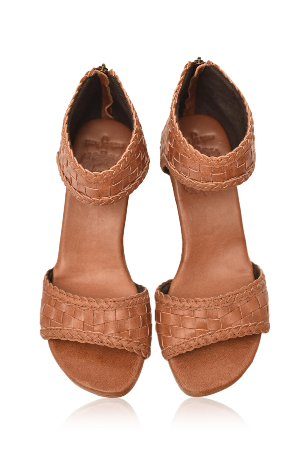 Athena Leather Wedges showcasing woven leather design with braided detailing and a wooden wedge heel.