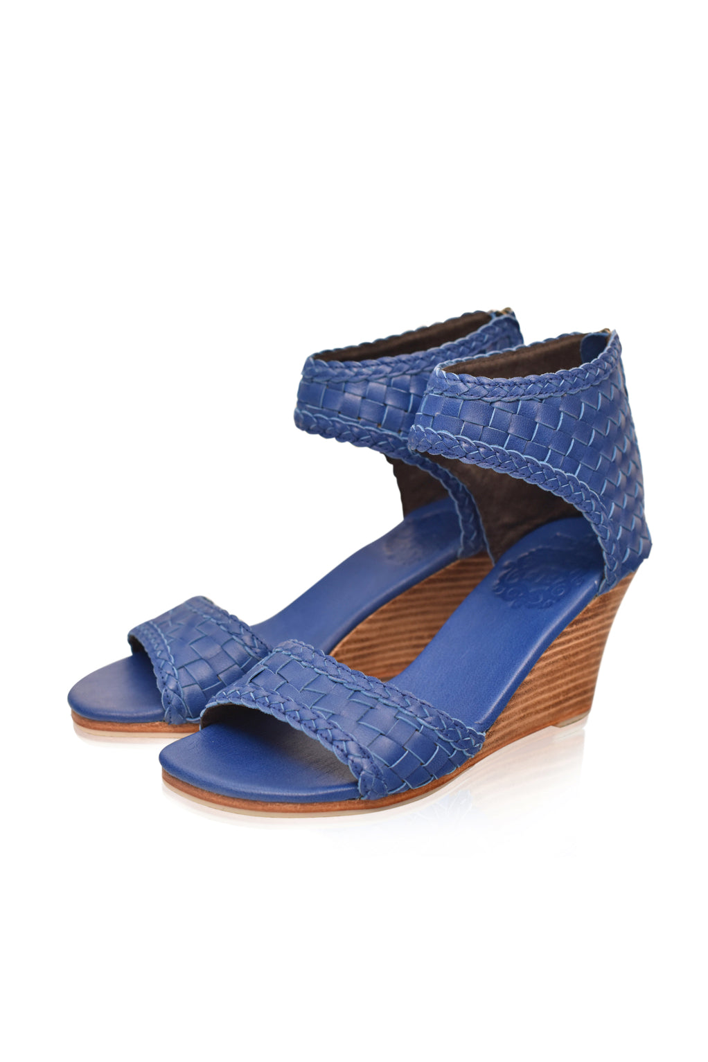 Athena Leather Wedges showcasing woven leather design with braided detailing and a wooden wedge heel.