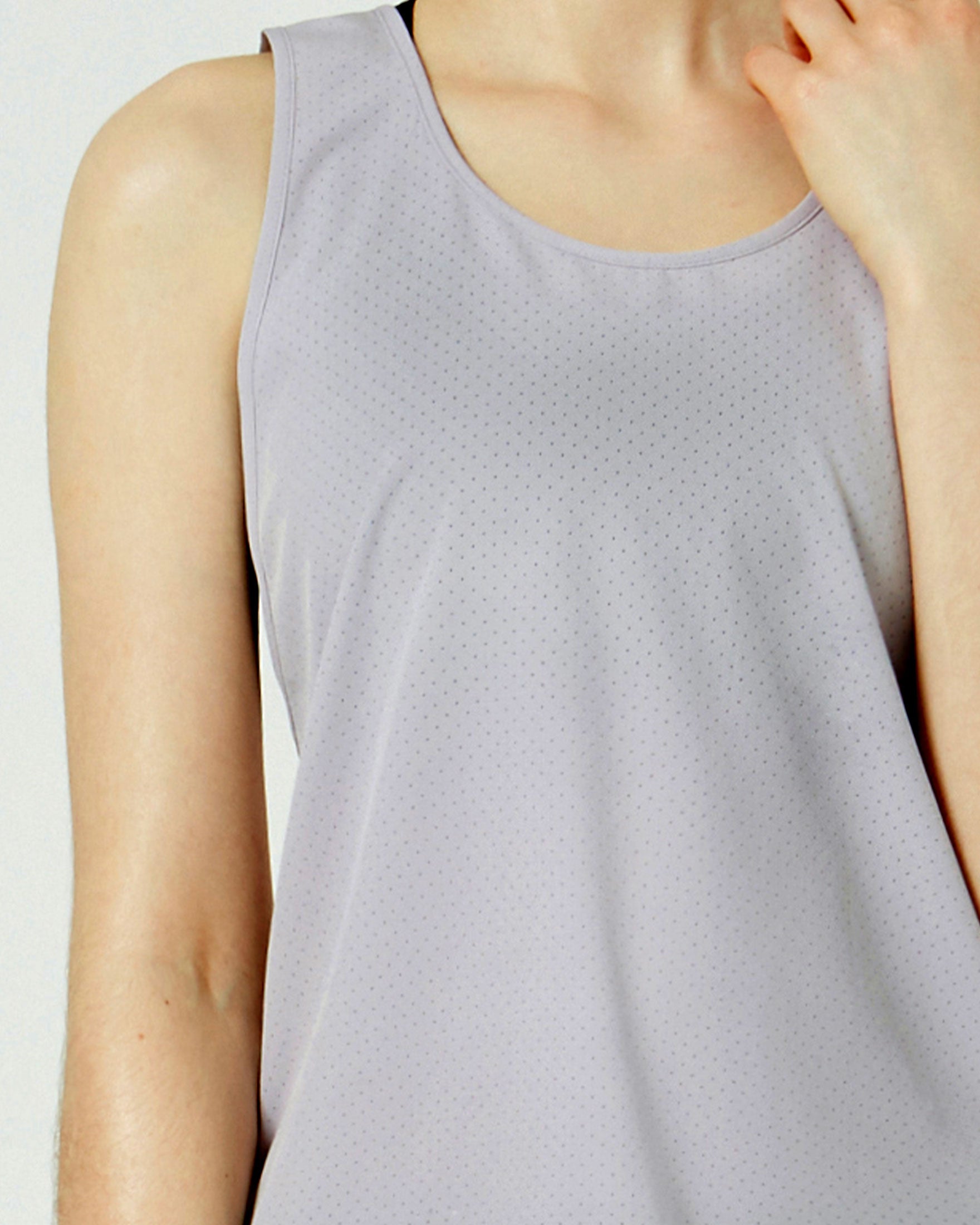 Atlas Laser Cut Mesh Tank featuring a low scooped racerback design and breathable laser cut mesh fabric, ideal for workouts and water activities.