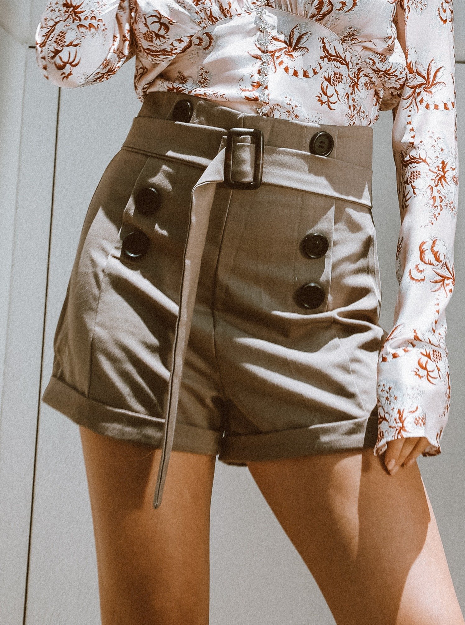 Ay, Ay Sailor Shorts featuring an ultra-high waist, belt detailing, and stylish black buttons on the sides.