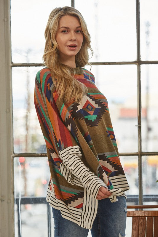 Azi Two Fer Poncho featuring a modern Aztec print, lightweight fabric, and stylish high neck design.