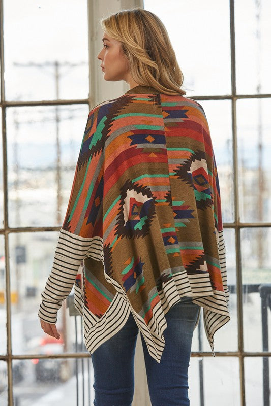 Azi Two Fer Poncho featuring a modern Aztec print, lightweight fabric, and stylish high neck design.